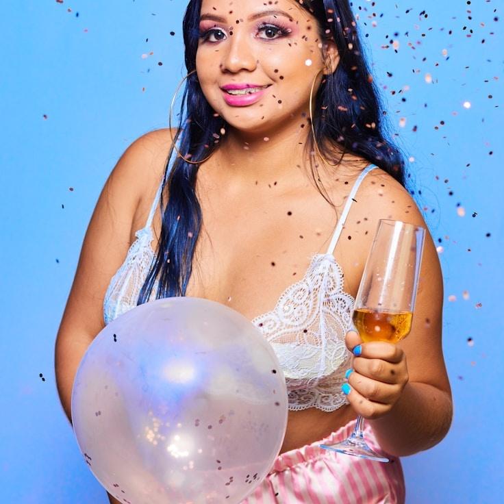 Kaveri Mehta, Lead Design Curator at Calm Ocean Platform, reviewing corporate floral arrangements